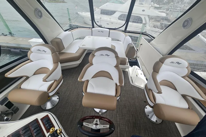Slide: The Image of 2007 Sea Ray 44 Sedan Bridge interior with luxurious seating and panoramic windows. - 17