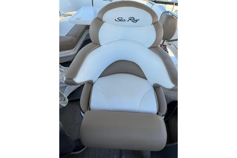 Slide: The Image of Captain's chair on 2007 Sea Ray 44 Sedan Bridge, featuring white and tan upholstery. - 18