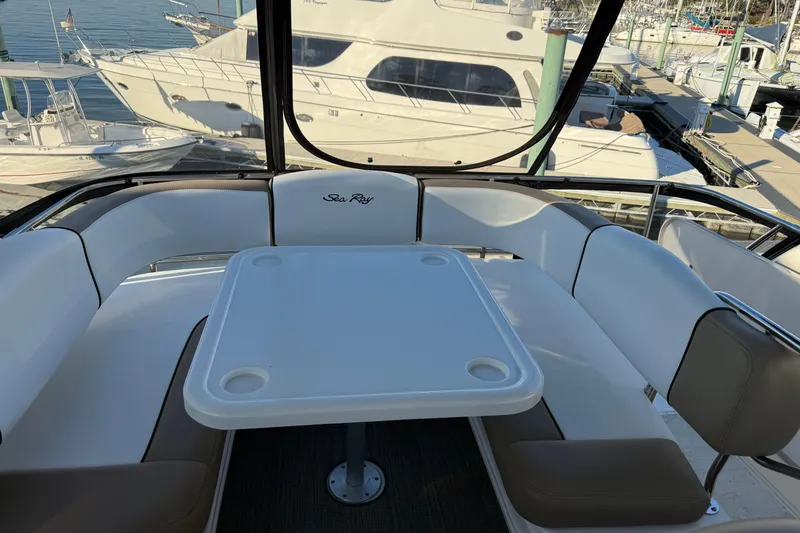 Slide: The Image of 2007 Sea Ray 44 Sedan Bridge yacht with spacious seating and table on deck. - 20
