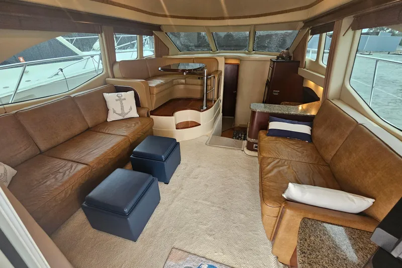 Slide: The Image of Luxurious interior of 2007 Sea Ray 44 Sedan Bridge yacht with leather seating and elegant decor. - 27