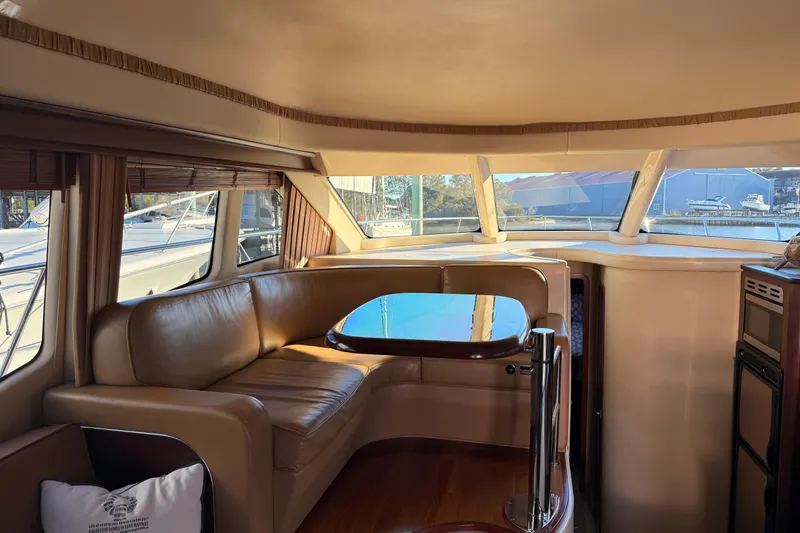 Slide: The Image of Luxurious interior of 2007 Sea Ray 44 Sedan Bridge yacht with leather seating and panoramic windows. - 33