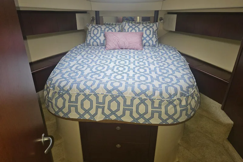 Slide: The Image of Luxurious bedroom interior of 2007 Sea Ray 44 Sedan Bridge yacht with patterned bedding. - 40