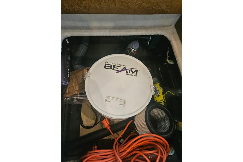 Slide: The Image of Central vacuum system in 2007 Sea Ray 44 Sedan Bridge boat storage compartment. - 51