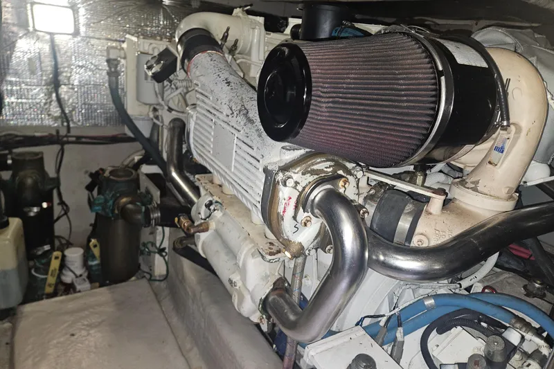 Slide: The Image of Engine room of 2007 Sea Ray 44 Sedan Bridge, showcasing detailed mechanical components. - 57