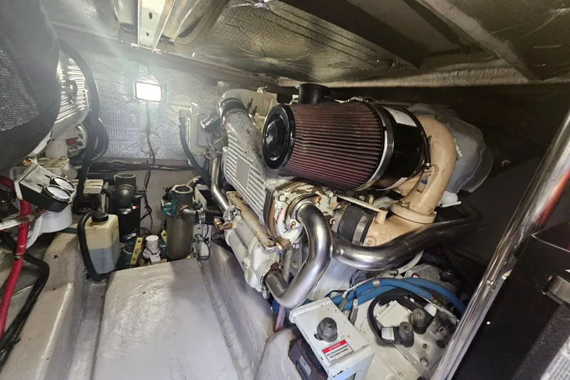 Slide: The Image of Engine room of 2007 Sea Ray 44 Sedan Bridge, showcasing mechanical components and equipment. - 58