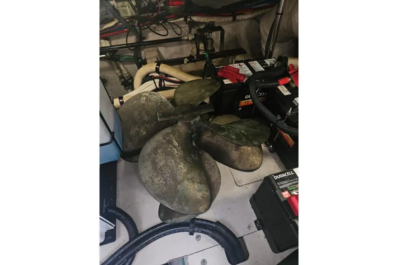 Slide: The Image of 2007 Sea Ray 44 Sedan Bridge engine room with propeller and batteries. - 59