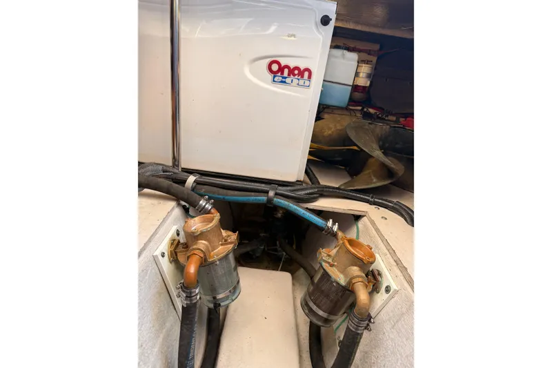 Slide: The Image of Engine room of 2007 Sea Ray 44 Sedan Bridge with Onan generator and components. - 63