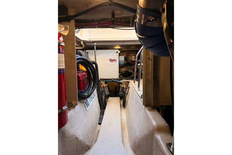 Slide: The Image of Engine room of 2007 Sea Ray 44 Sedan Bridge with visible equipment and fire extinguisher. - 64