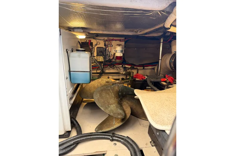 Slide: The Image of Engine room of 2007 Sea Ray 44 Sedan Bridge with propeller and equipment. - 67