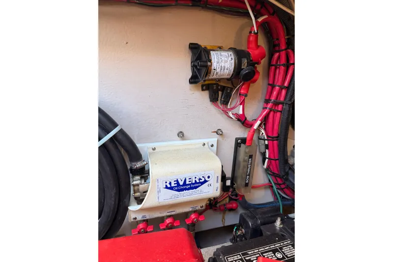 Slide: The Image of Engine room of 2007 Sea Ray 44 Sedan Bridge with Reverso oil change system. - 68