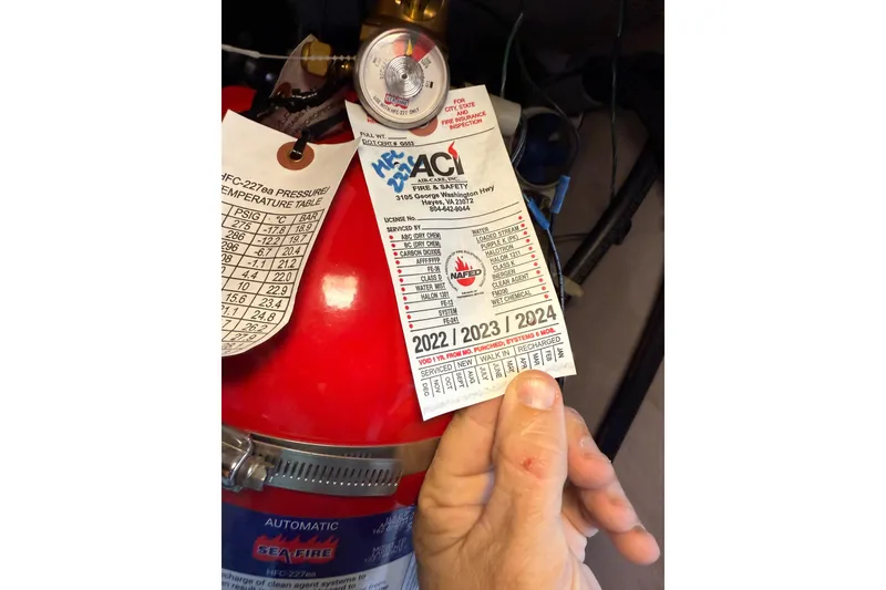 Slide: The Image of Fire extinguisher inspection tag on 2007 Sea Ray 44 Sedan Bridge yacht. - 70
