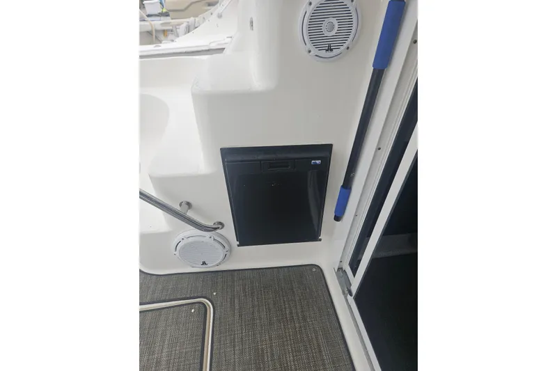 Slide: The Image of 2007 Sea Ray 44 Sedan Bridge interior with speaker and storage compartment. - 8