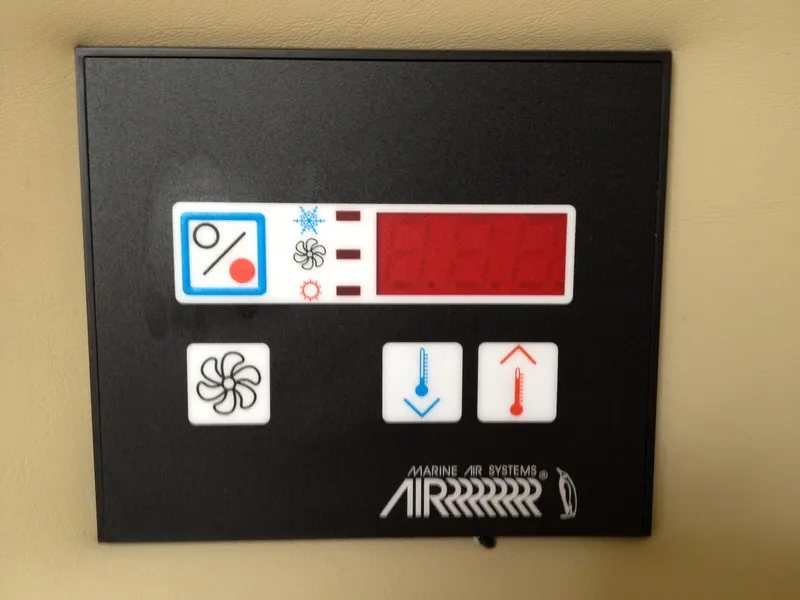Slide: The Image of Control panel for Marine Air Systems on a 2006 Rinker 320 Express Cruiser. - 31