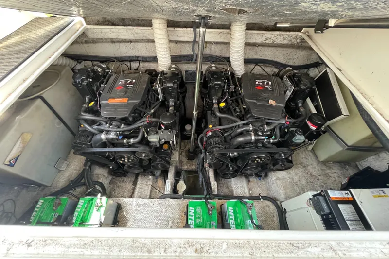 Slide: The Image of Engine compartment of a 2006 Rinker 320 Express Cruiser with dual engines and batteries. - 39