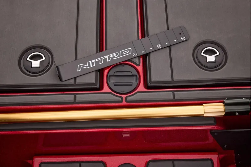 Slide: The Image of Manufacturer Provided Image: Nitro Z20 XL 2026 boat pedal and control panel in red interior. - 48