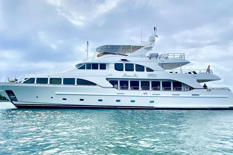 Slide: The Image of Luxury 2007 Benetti 120 Classic yacht on serene water under cloudy sky. - 1