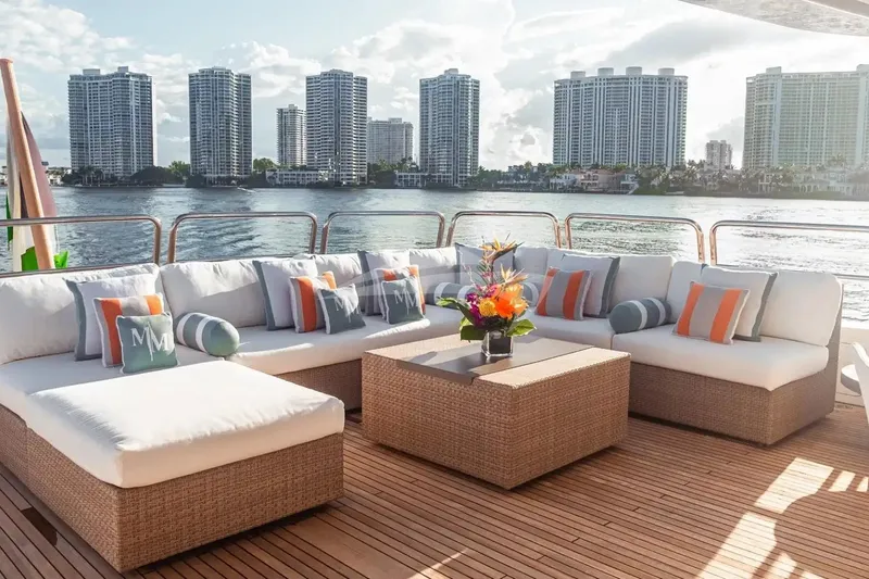 Slide: The Image of Luxurious deck seating on 2007 Benetti 120 Classic yacht with waterfront cityscape view. - 12