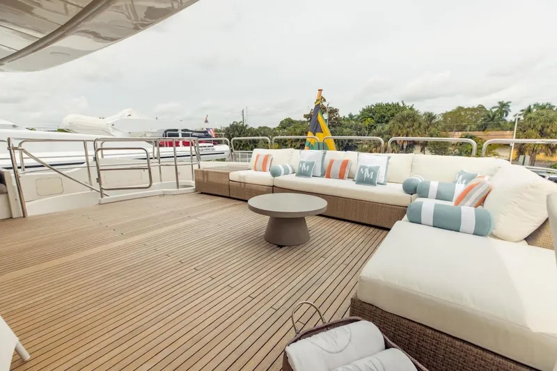 Slide: The Image of Luxurious deck of 2007 Benetti 120 Classic yacht with elegant seating and cushions. - 14