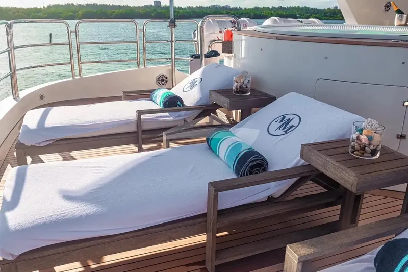 Slide: The Image of Luxury sun loungers on 2007 Benetti 120 Classic yacht deck, overlooking serene waters. - 20