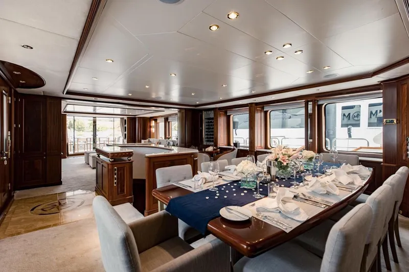 Slide: The Image of Luxurious dining area on a 2007 Benetti 120 Classic yacht, featuring elegant table settings. - 27
