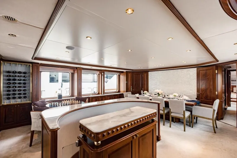 Slide: The Image of Luxurious interior of 2007 Benetti 120 Classic yacht with elegant dining area and wine display. - 29