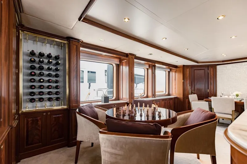 Slide: The Image of Luxurious interior of 2007 Benetti 120 Classic yacht with wine rack and chess table. - 30