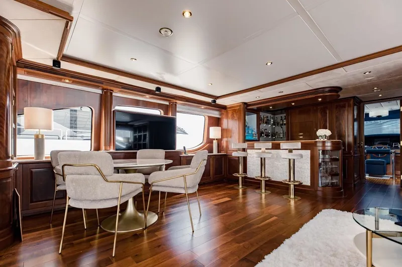 Slide: The Image of Luxurious interior of 2007 Benetti 120 Classic yacht with elegant dining and bar area. - 34