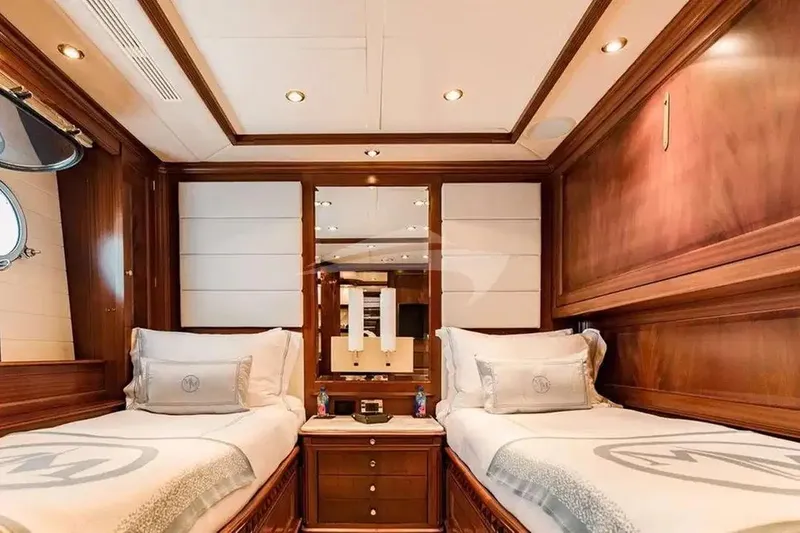 Slide: The Image of Luxurious twin cabin interior on 2007 Benetti 120 Classic yacht, featuring elegant wood paneling. - 40