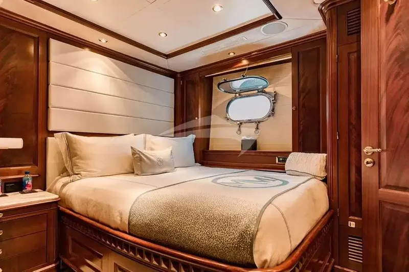 Slide: The Image of Luxurious bedroom interior on a 2007 Benetti 120 Classic yacht, featuring elegant wood finishes. - 41
