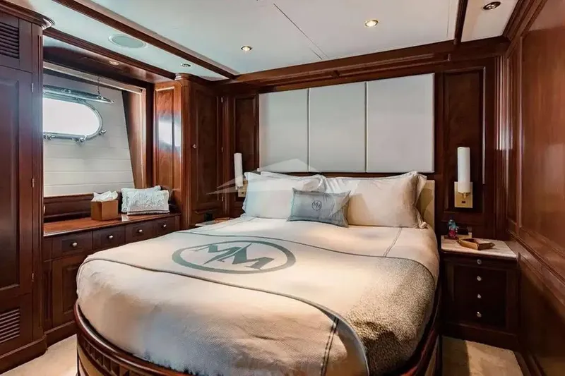 Slide: The Image of Luxurious bedroom interior on a 2007 Benetti 120 Classic yacht, featuring elegant wood paneling. - 42