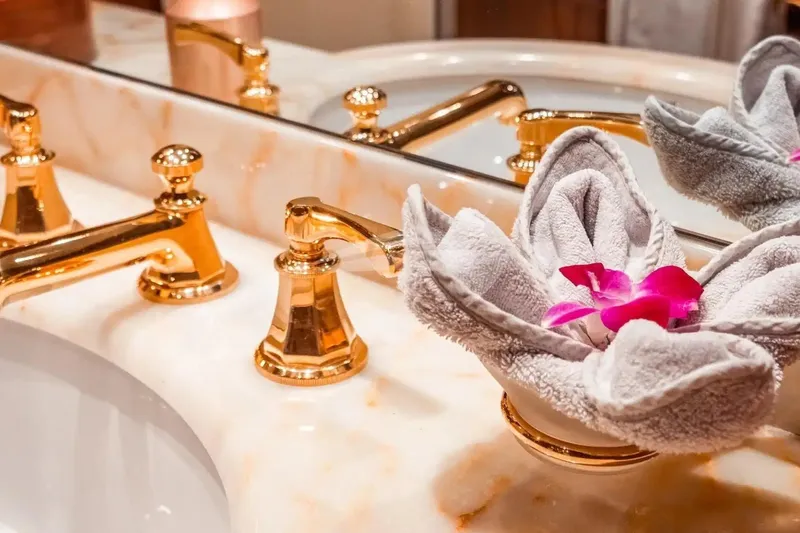 Slide: The Image of Luxurious bathroom sink with gold fixtures and decorative towel on Benetti 120 Classic yacht. - 44