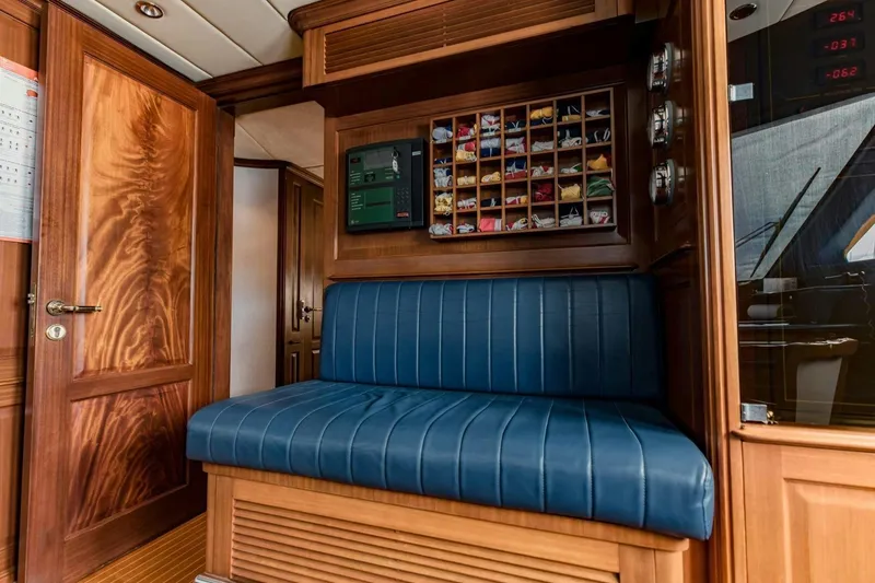 Slide: The Image of Luxurious interior of 2007 Benetti 120 Classic yacht with blue seating and wooden accents. - 48
