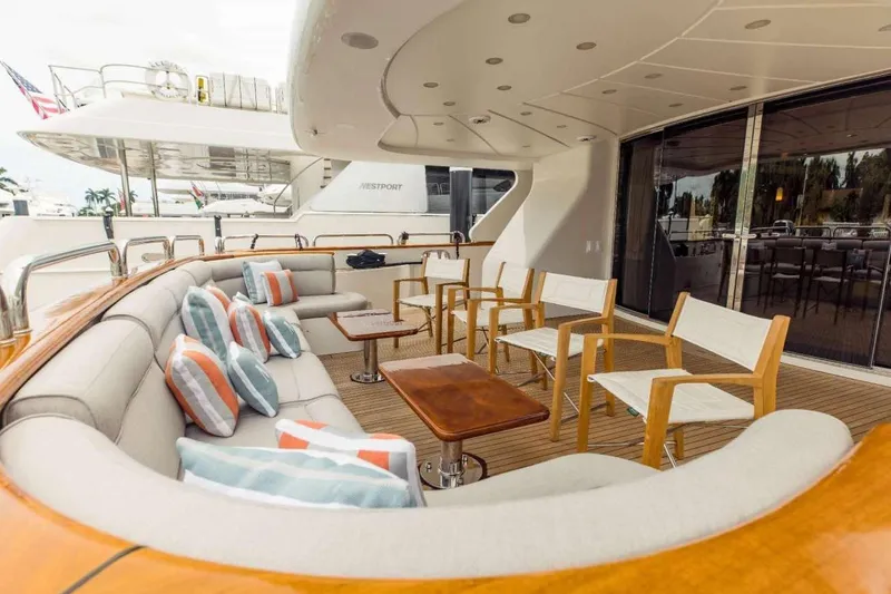 Slide: The Image of Luxurious 2007 Benetti 120 Classic yacht deck with elegant seating and cushions. - 9