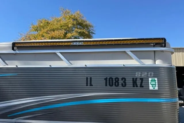 Slide: The Image of 2019 Qwest Edge 280 Cruise boat with registration IL 1083 KZ, under clear blue sky. - 22