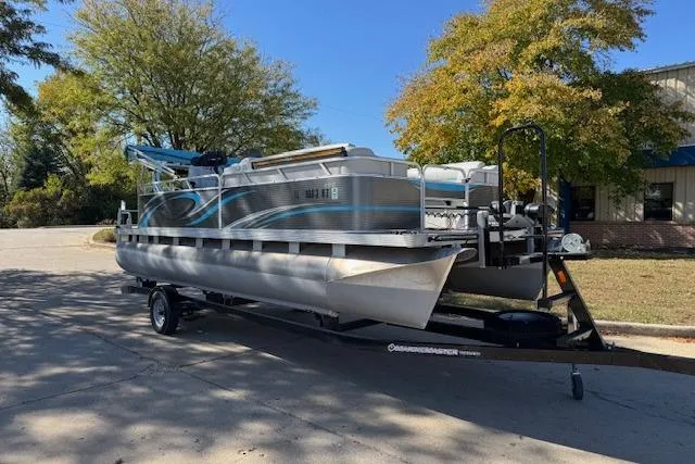 Slide: The Image of 2019 Qwest Edge 280 Cruise pontoon boat on trailer, parked outdoors. - 3