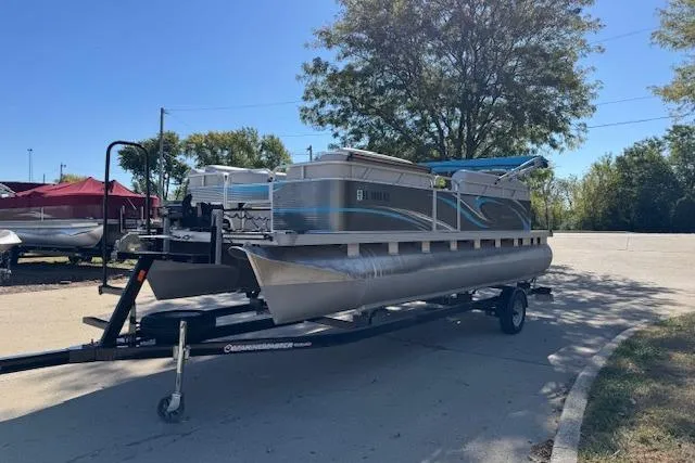 Slide: The Image of 2019 Qwest Edge 280 Cruise pontoon boat on trailer in sunny outdoor setting. - 4