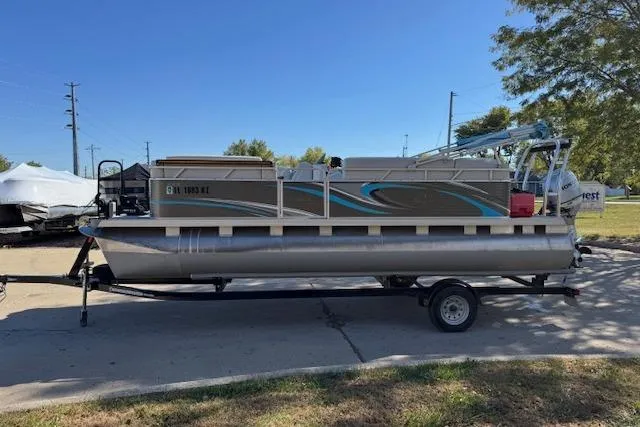 Slide: The Image of 2019 Qwest Edge 280 Cruise pontoon boat on trailer, parked outdoors. - 5