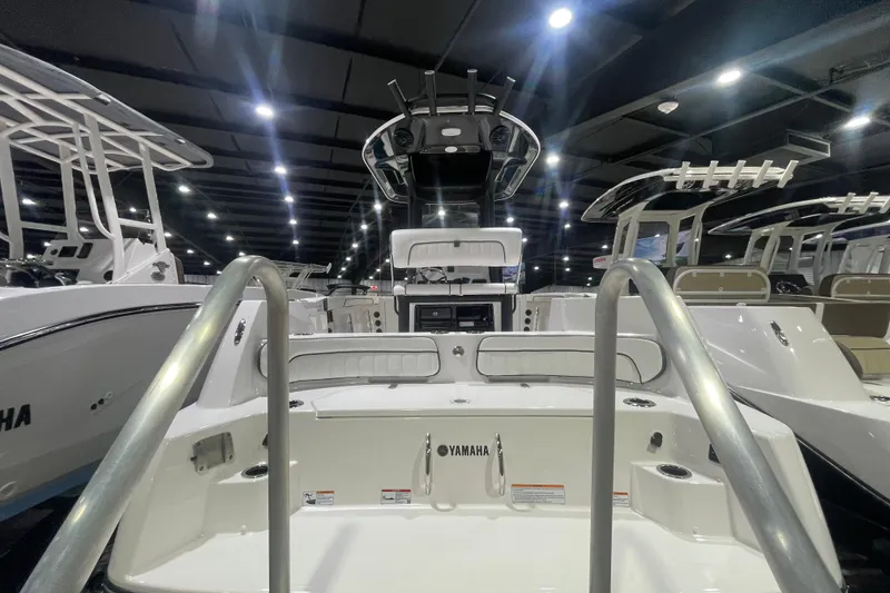 Slide: The Image of 2025 Yamaha Boats 222 FSH Sport E displayed in a showroom, showcasing sleek design. - 3