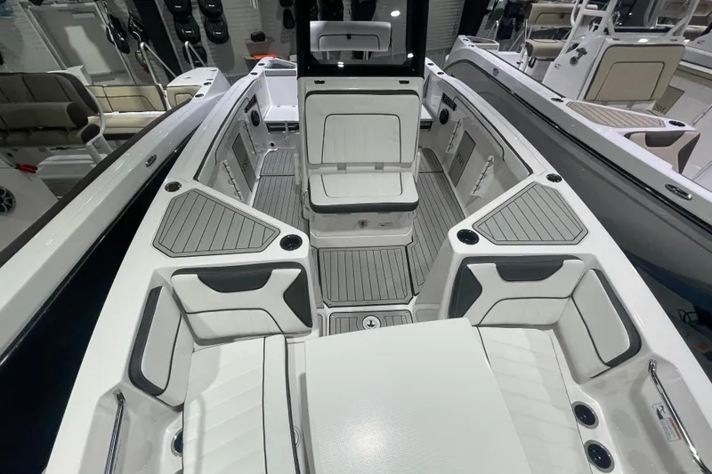 Slide: The Image of 2025 Yamaha Boats 222 FSH Sport E interior with sleek seating and modern design. - 6