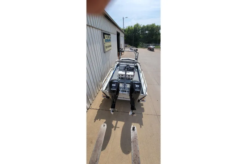 Slide: The Image of 2025 AQUAWKA BOATS 2072 OB ALUMINUM with dual outboard motors on trailer. - 11