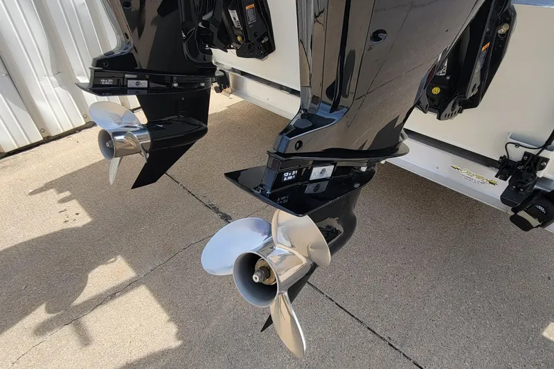 Slide: The Image of Dual outboard motors on a 2025 AQUAWKA BOATS 2072 ALUMINUM, featuring sleek propellers. - 4