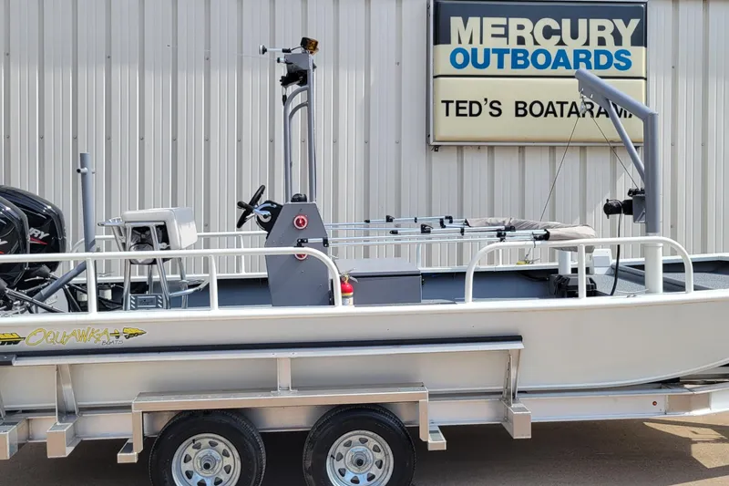 Slide: The Image of 2025 AQUAWKA BOATS 2072 Aluminum on trailer at Ted's Boatarama, Mercury Outboards sign visible. - 14