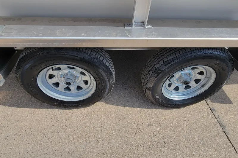 Slide: The Image of Dual wheels of 2025 AQUAWKA BOATS 2072 ALUMINUM trailer on pavement. - 5