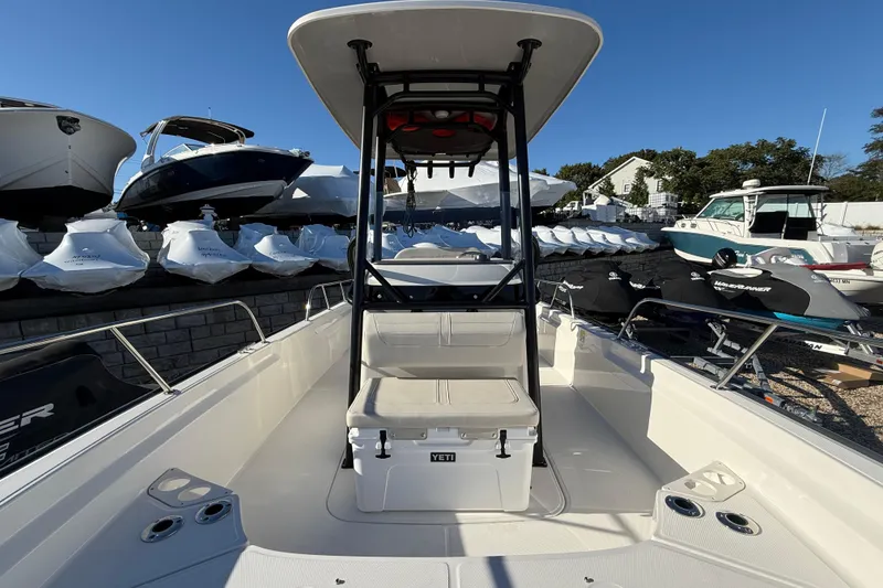 Slide: The Image of 2023 Boston Whaler 210 Montauk boat interior with T-top and YETI cooler. - 18