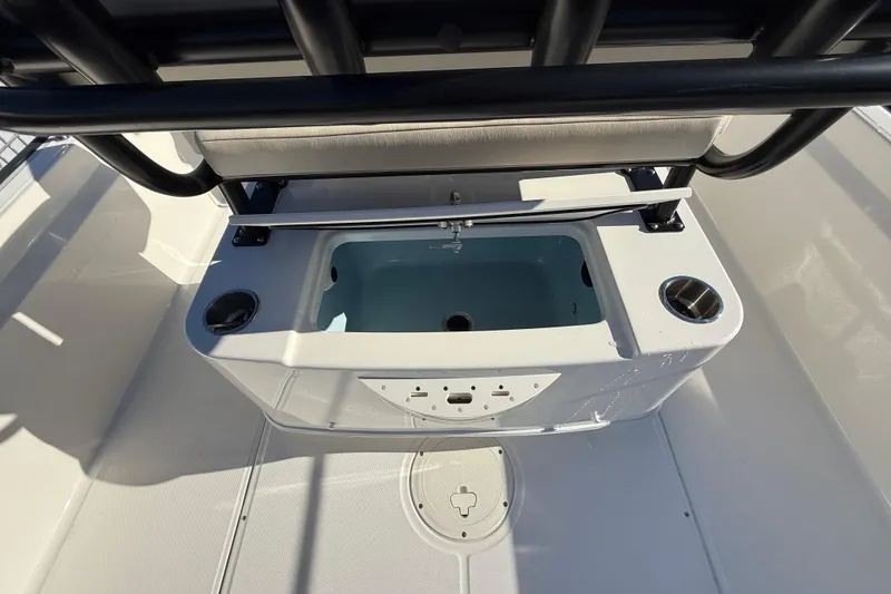 Slide: The Image of 2023 Boston Whaler 210 Montauk boat interior with livewell and cup holders. - 8