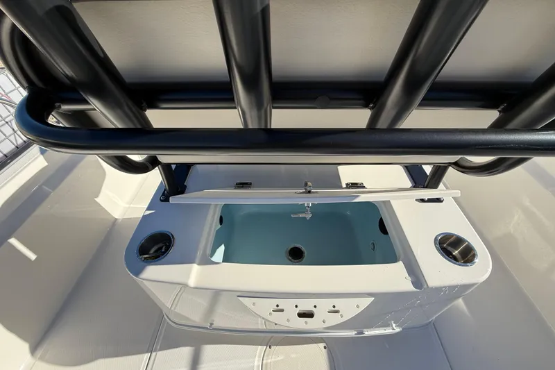 Slide: The Image of 2023 Boston Whaler 210 Montauk boat interior with livewell and rod holders. - 9