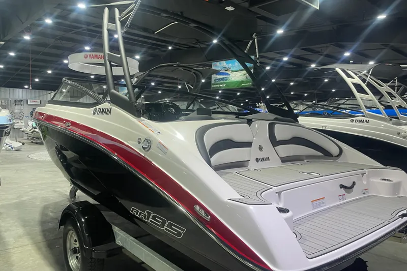 Slide: The Image of 2025 Yamaha AR195 boat displayed indoors, showcasing sleek design and modern features. - 3
