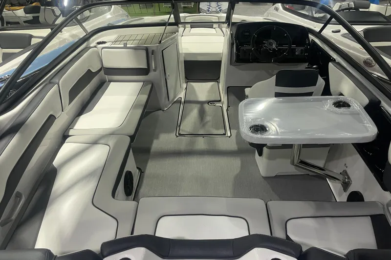 Slide: The Image of 2025 Yamaha Boats AR195 interior with sleek seating and modern dashboard design. - 5