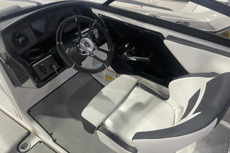Slide: The Image of 2025 Yamaha Boats AR195 cockpit with sleek steering wheel and modern dashboard design. - 6