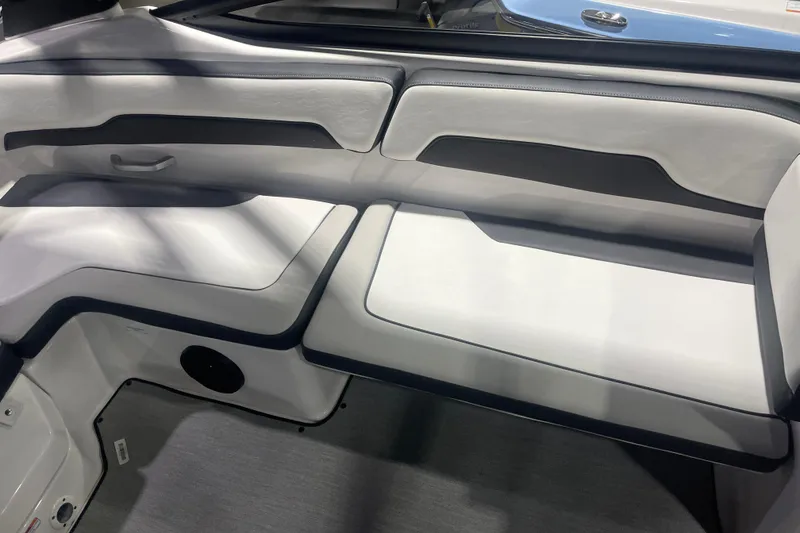 Slide: The Image of 2025 Yamaha AR195 boat interior with sleek white and black seating design. - 8